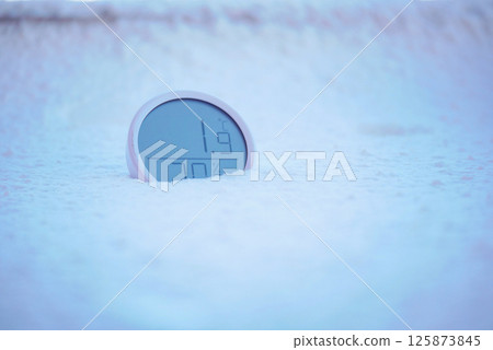 Digital thermometer shows low temperature in snow Digital thermometer shows low temperature in snow 125873845