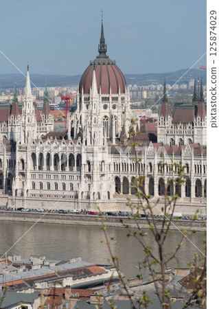 The Hungarian Parliament Building in Budapest, Hungary, stands majestically on the Danube riverbank The Hungarian Parliament Building in Budapest, Hungary, stands majestically on the Danube riverbank 125874029