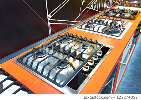Modern gas stoves in store Modern gas stoves in store 125874052