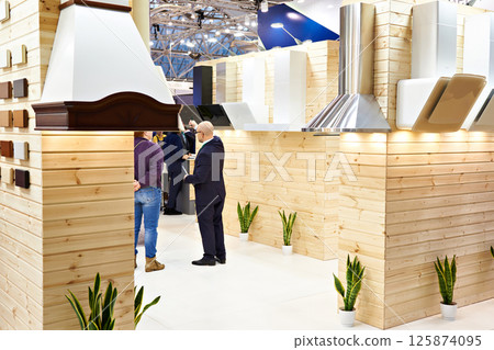 Kitchen hoods in furniture store 125874095