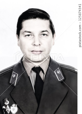 Vintage portrait of a middle-aged man in a military doctor's uniform. Lieutenant Colonel of the medical troops. Retro photo from 1987. 125874341
