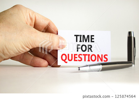 Time for questions symbol. Concept words Time for questions on beautiful white card. Beautiful white background. Businessman hand. Business time for questions concept. Copy space. 125874564