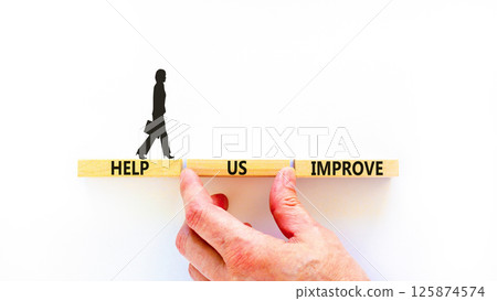 Help us improve symbol. Concept words Help us improve on beautiful wooden blocks. Beautiful white background. Businesswoman icon. Business motivational help us improve concept. Copy space. 125874574