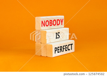 Nobody is perfect symbol. Concept words Nobody is perfect on beautiful wooden block. Beautiful orange table orange background. Business motivational lifestyle and nobody is perfect concept. Copy space Nobody is perfect symbol. Concept words Nobody is perfect on beautiful wooden block. Beautiful orange table orange background. Business motivational lifestyle and nobody is perfect concept. Copy space 125874582