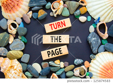 Turn the page symbol. Concept words Turn the page on beautiful wooden block. Sea stones and shells. Beautiful black background. Business motivational lifestyle turn the page concept. Copy space. Turn the page symbol. Concept words Turn the page on beautiful wooden block. Sea stones and shells. Beautiful black background. Business motivational lifestyle turn the page concept. Copy space. 125874583