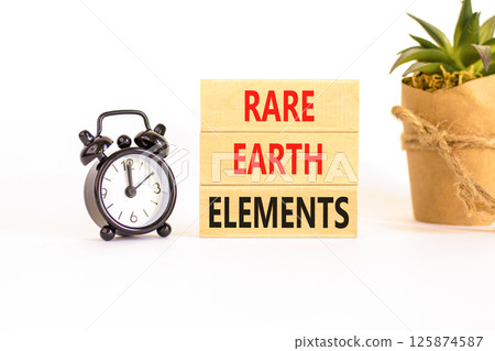 Rare earth elements symbol. Concept words Rare earth elements on beautiful wooden block. Black alarm clock. Beautiful white background. Business and rare earth elements concept. Copy space. Rare earth elements symbol. Concept words Rare earth elements on beautiful wooden block. Black alarm clock. Beautiful white background. Business and rare earth elements concept. Copy space. 125874587