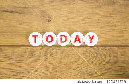 Today symbol. Concept word Today on beautiful white pills circles. Beautiful wooden table wooden background. Business lifestyle today concept. Copy space. Today symbol. Concept word Today on beautiful white pills circles. Beautiful wooden table wooden background. Business lifestyle today concept. Copy space. 125874719