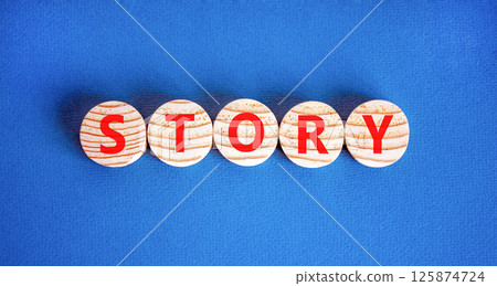 Story symbol. Concept word Story on beautiful wooden circles. Beautiful blue table blue background. Business lifestyle story concept. Copy space. Story symbol. Concept word Story on beautiful wooden circles. Beautiful blue table blue background. Business lifestyle story concept. Copy space. 125874724