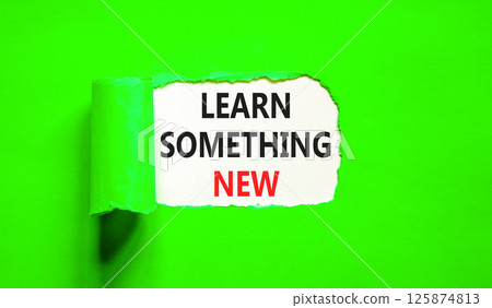 Learn something new symbol. Concept words Learn something new on beautiful white paper. Beautiful green paper background. Business motivational lifestyle learn something new concept. Copy space. 125874813