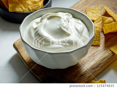 bowl of sour cream yogurt dip 125874835