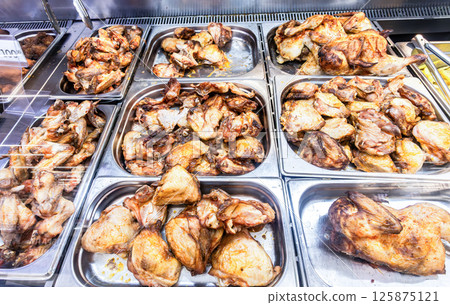 Showcase with tasty fried chicken meat 125875121