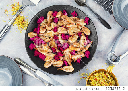 Prawns shrimps roasted with dragon fruit. 125875542