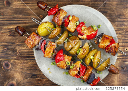 Meat skewers with potatoes. Meat skewers with potatoes. 125875554