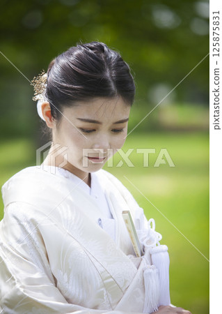 Bride wearing white dress 125875831