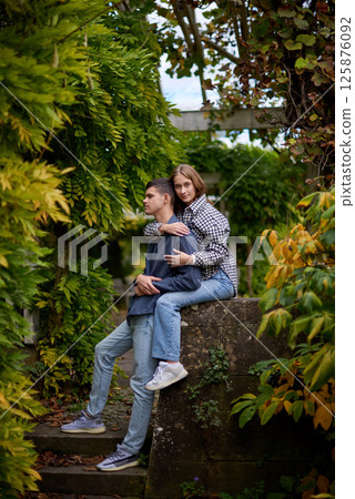 Young Cute Female Hugs Boyfriend. In Autumn Outdoor. Lovers Walking in Park. Attractive Funny Couple. Lovestory in Forest. Man and Woman. Cute Lovers in the Park. Family Concept. Happy Couple. Young Cute Female Hugs Boyfriend. In Autumn Outdoor. Lovers Walking in Park. Attractive Funny Couple. Lovestory in Forest. Man and Woman. Cute Lovers in the Park. Family Concept. Happy Couple. 125876092
