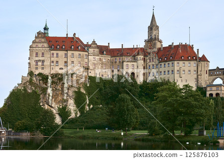 Majestic Sigmaringen Castle Perched on Rugged Cliff Above Tranquil Danube: Historic Hohenzollern Residence Showcases Medieval Architecture and Royal Collections in Picturesque Baden-Wurttemberg Majestic Sigmaringen Castle Perched on Rugged Cliff Above Tranquil Danube: Historic Hohenzollern Residence Showcases Medieval Architecture and Royal Collections in Picturesque Baden-Wurttemberg 125876103
