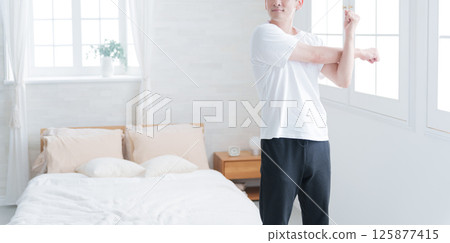 Middle-aged man stretching Middle-aged man stretching 125877415