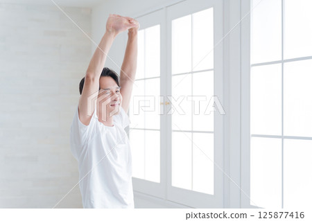 Middle-aged man stretching Middle-aged man stretching 125877416