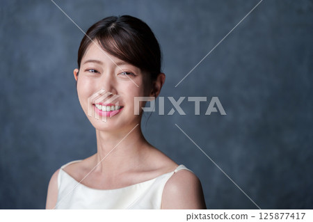 A young woman with a smile 125877417