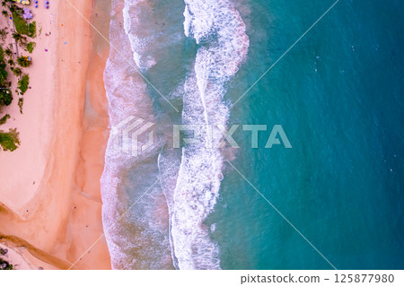 Aerial Top view beach background,Amazing beach with waves crashing on sandy shore,Top view nature sea sand background 125877980