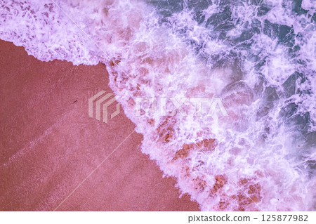 Aerial Top view beach background,Amazing beach with waves crashing on sandy shore,Top view nature sea sand background Aerial Top view beach background,Amazing beach with waves crashing on sandy shore,Top view nature sea sand background 125877982