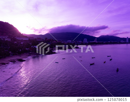 Aerial view landscape mountains colorful purple sky over sea Aerial view landscape mountains colorful purple sky over sea 125878015