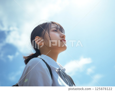 School girls looking up at the sky School girls looking up at the sky 125878122