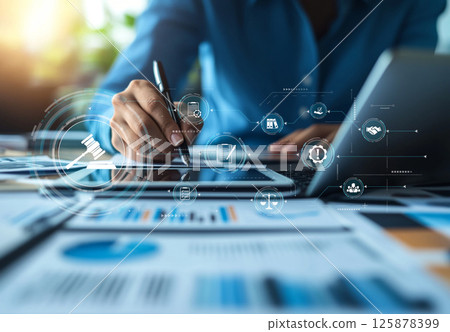 Professional Hand Writing Notes on Tablet with Digital Compliance and Regulation Icons in Modern Office Environment XDMCP 125878399