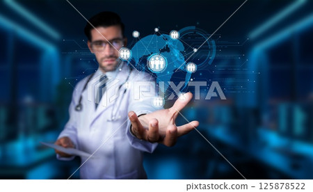 Medical professional presenting global health technology concepts in a modern digital environment with holographic elements and interconnected healthcare networks. PHMT Medical professional presenting global health technology concepts in a modern digital environment with holographic elements and interconnected healthcare networks. PHMT 125878522