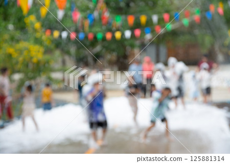 Blurred image of Children have fun at foam party bubble. Blurred image of Children have fun at foam party bubble. 125881314