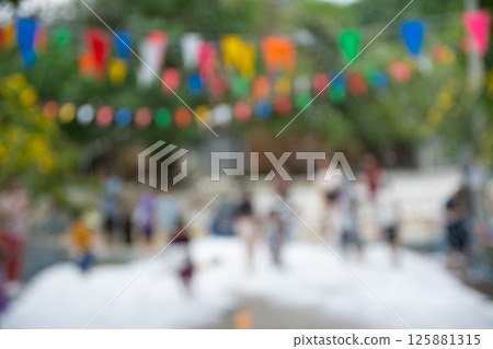Blurred image of Children have fun at foam party bubble. Blurred image of Children have fun at foam party bubble. 125881315