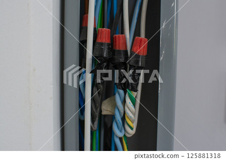group of power lines inside electrical wireway installed on the wall group of power lines inside electrical wireway installed on the wall 125881318