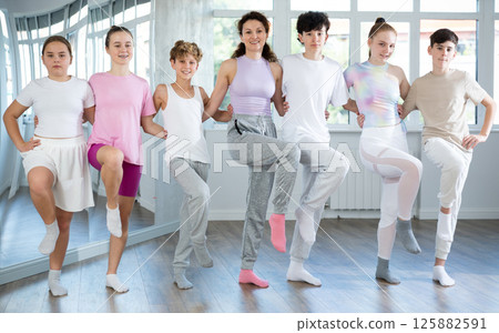 Teen dancers learn to dance Greek folk dance sirtaki and the Irish folk dance jig Teen dancers learn to dance Greek folk dance sirtaki and the Irish folk dance jig 125882591