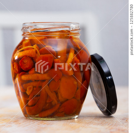 Marinated honey fungi in glass jar Marinated honey fungi in glass jar 125882780
