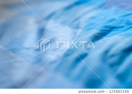Fluid motion aqua tones abstract art indoor gallery calm environment close-up view 125883140