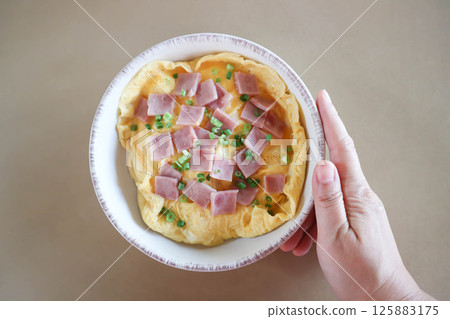 creamy omelet or omelet or omelette or fried egg with ham and green onion 125883175