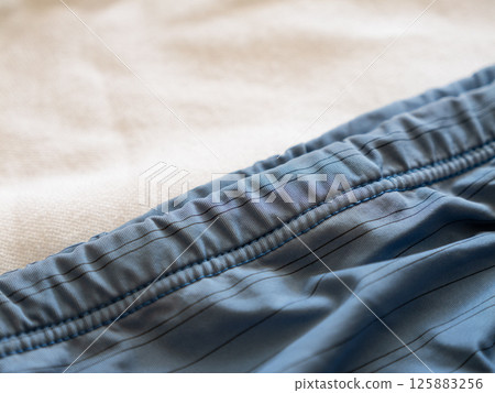 Exploring comfortable swimwear fabric detailed indoor textiles a cozy environment Exploring comfortable swimwear fabric detailed indoor textiles a cozy environment 125883256