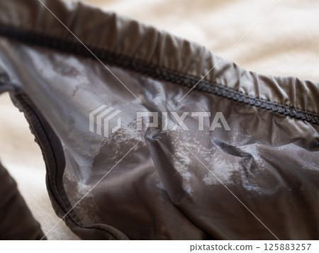 Exploring fabric quality apparel design close-up view of textile material indoor setting 125883257