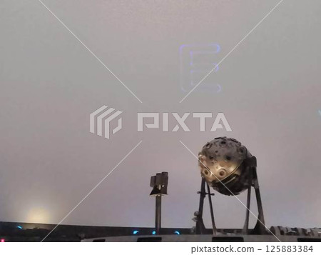 Planetarium projector floating in the dark Planetarium projector floating in the dark 125883384