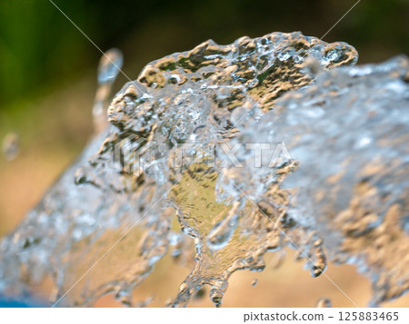 Dynamic water splashing action natural environment nature close-up view fluid motion inspiration 125883465