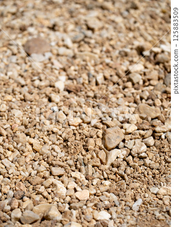 Exploring gravel texture construction site natural material outdoor ground level earthy aesthetics 125883509