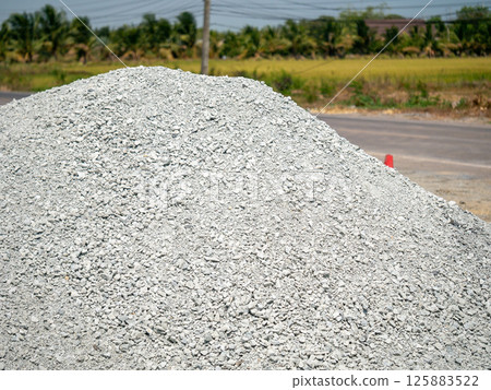 Construction materials delivery rural road landscape clear skies ground view industrial supply Construction materials delivery rural road landscape clear skies ground view industrial supply 125883522