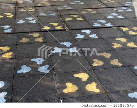 Colorful footprints paved path urban park outdoor ground level playful concept 125883572