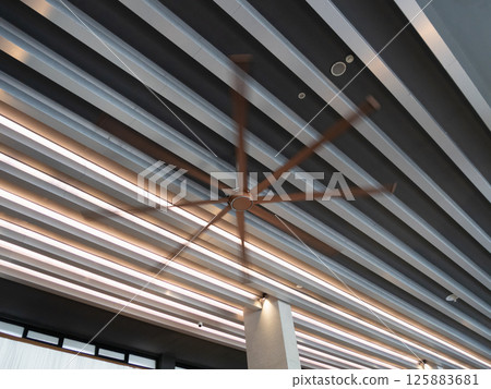 Ceiling fan modern space indoor design contemporary low angle view airflow concept Ceiling fan modern space indoor design contemporary low angle view airflow concept 125883681