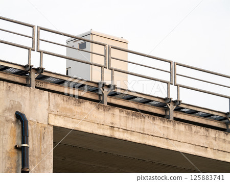 Technology-focused industrial equipment installation in urban infrastructure with elevated view Technology-focused industrial equipment installation in urban infrastructure with elevated view 125883741