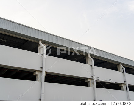 Parking structure overview urban area building daytime elevated view modern architecture Parking structure overview urban area building daytime elevated view modern architecture 125883870