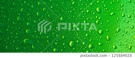 shiny green background with texture of rain drops on metal surface close up shiny green background with texture of rain drops on metal surface close up 125884028