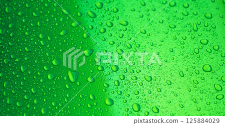 abstract green background with texture of rain drops on a metal surface close-up abstract green background with texture of rain drops on a metal surface close-up 125884029