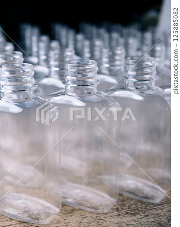 Row of plastic PET Bottles Production Line - Ready for Bottling. Row of plastic PET Bottles Production Line - Ready for Bottling. 125885082