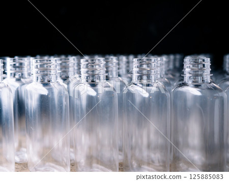 Row of plastic PET Bottles Production Line - Ready for Bottling. Row of plastic PET Bottles Production Line - Ready for Bottling. 125885083